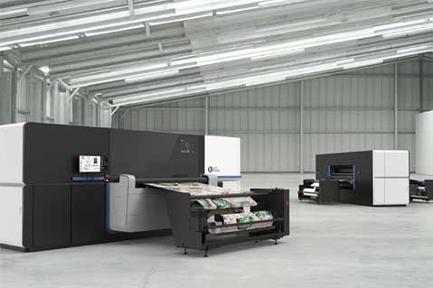 Large industrial printing machines Description automatically generated with medium confidence