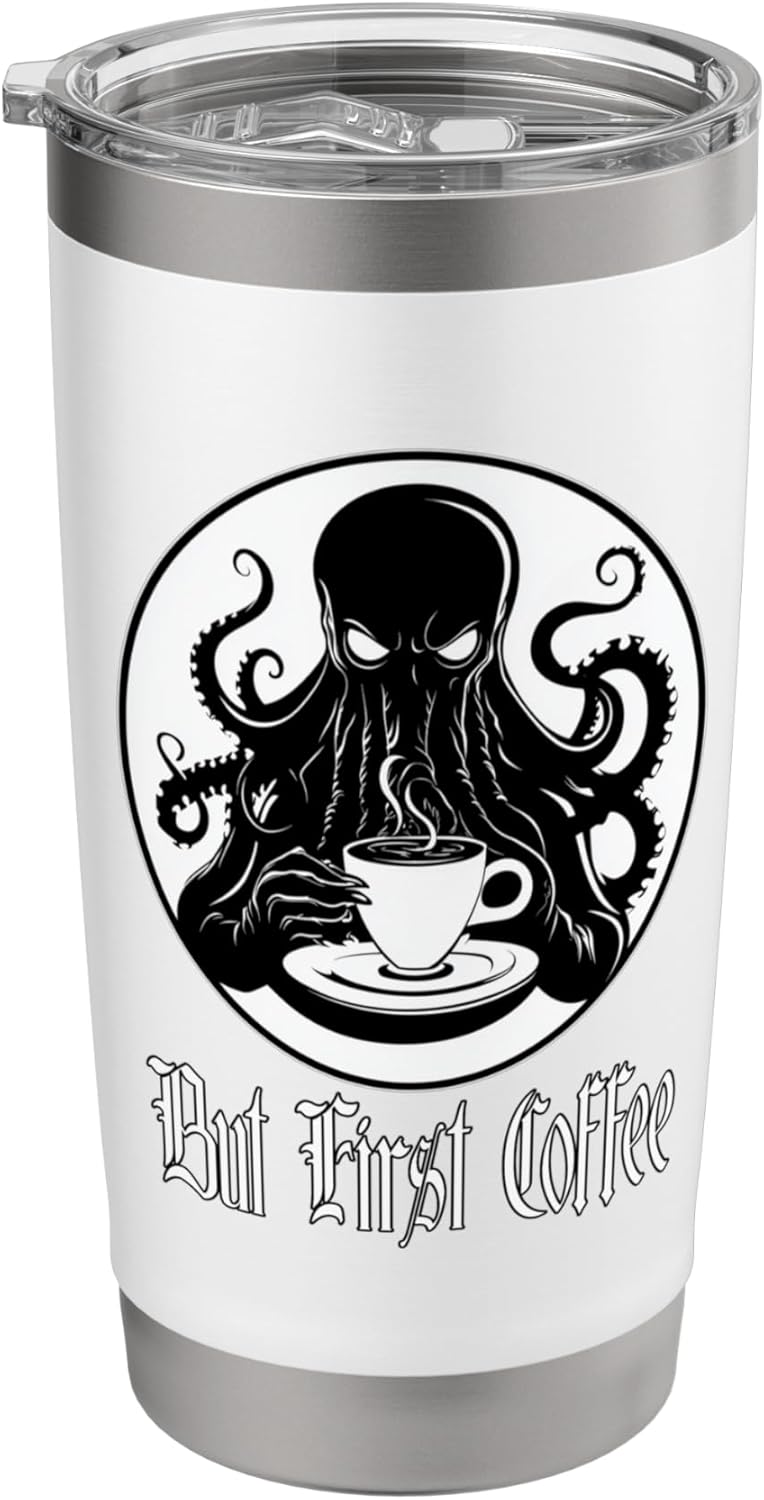 A white cup with a black and white design Description automatically generated
