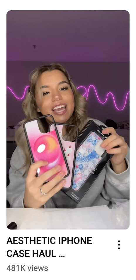 A person holding up a phone case Description automatically generated