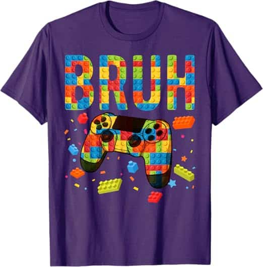 A purple t-shirt with a video game controller and colorful blocks Description automatically generated