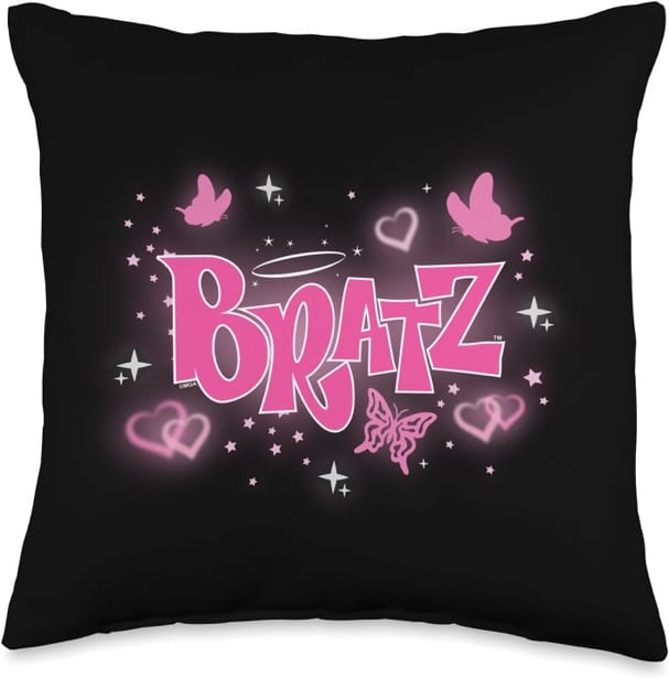 A black pillow with pink text and hearts Description automatically generated