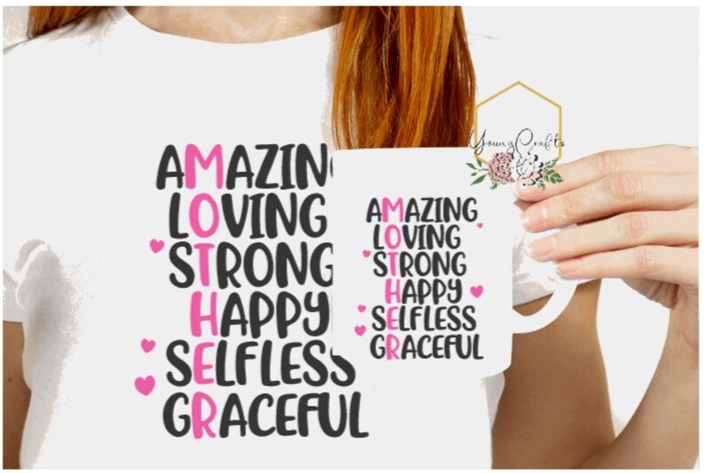 May include: White t-shirt and mug with the text "AMAZING LOVING STRONG HAPPY SELFLESS GRACEFUL" spelled vertically, with the letters "MOTHER" highlighted in pink.