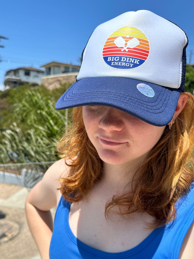 A person wearing a hat Description automatically generated