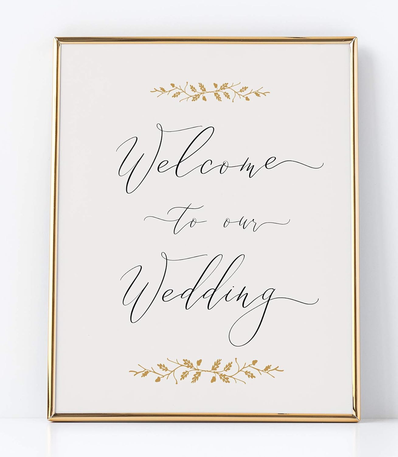A white sign with gold leaves and text Description automatically generated